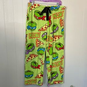 Nickelodeon Ninja Turtle pizza pajama pants - size L - small black spot on leg